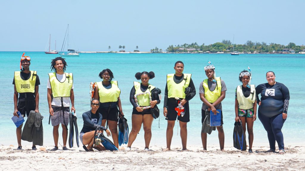 Rising Tides students and instructors Dr. Karlisa Callwood and Danielle Cartwright gather at Jaws Beach, ready to snorkel and explore the rich biodiversity and critical importance of seagrass ecosystems.