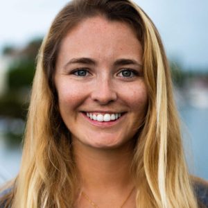 Kate, a PADI Course Director and Coral Restoration Specialist, teaching marine conservation techniques underwater.